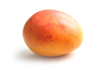 closeup of mini mango on white background
