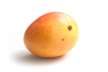 closeup of mini mango on white background