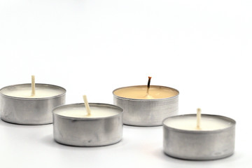 Selective focus close up burning candle isolate on white background.