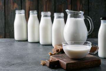 Fresh milk in different glass bottles