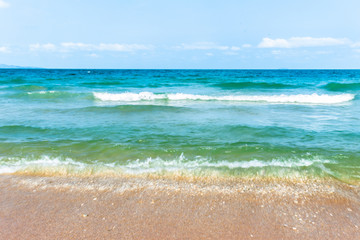 Fototapeta na wymiar Soft beautiful ocean wave on sandy beach.