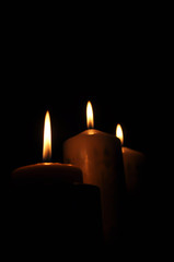 Fototapeta na wymiar Candle light on dark room