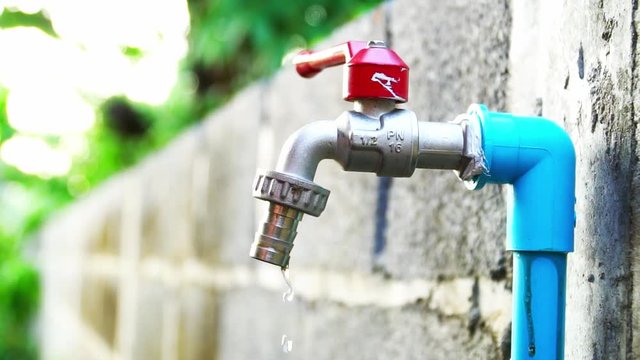 Water flows out of the tap.