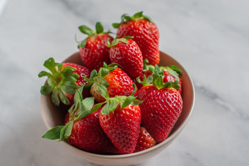 Loosely put the strawberries in different positions