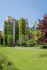 Fototapeta na wymiar Apartment building with a large courtyard around the green neighbourhood of Milan