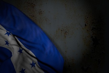 pretty dark picture of Honduras flag with big folds on rusty metal with empty place for text - any occasion flag 3d illustration..