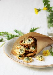 dandelion flowers fried in deep fried. Recipes from dandelion. organic healthy food. spring recipe. dishes from the first green.