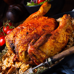 Grilled spicy chicken with barley groats and mushrooms