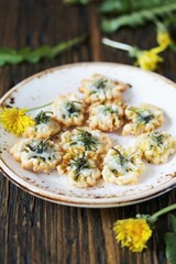 dandelion flowers fried in deep fried. Recipes from dandelion. organic healthy food. spring recipe. dishes from the first green.