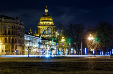 Beautiful night view of Nevsky Prospect and Isaac's Cathedral near Palace Square in Saint Petersburg. Colorful illumination for prominent russian landmark. Saint-Petersburg, Russia