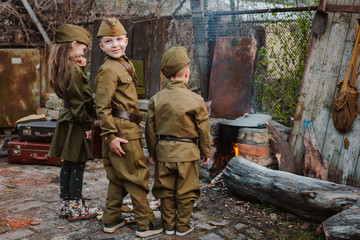 young child in military uniform on holiday day of victory, May 9, Russia.