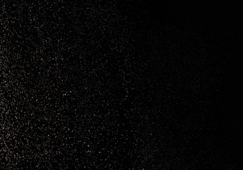 Fototapeta na wymiar festive dust in the air on a black background