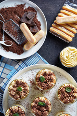 portions of tiramisu, italian dessert in glasses