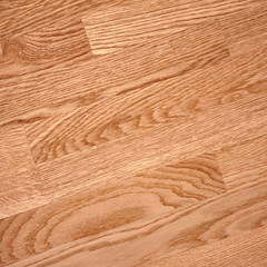 Fine natural solid valuable species of wood laminate parquet floor texture background. Wooden boards painted with natural oil, wax or mastic.