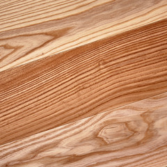 Fototapeta premium Fine natural solid valuable species of wood laminate parquet floor texture background. Wooden boards painted with natural oil, wax or mastic.