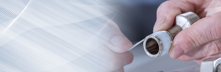 Plumber putting a sealing tape on a thread. panoramic banner