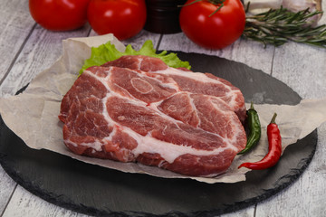 Raw pork neck steak