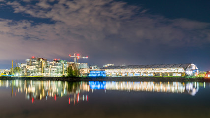 A night view of No 2 Road Bridge and several apartment buildings in Richmond, British Columbia.