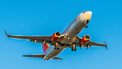 Aeroplane Photographed From Below at landing,  bottom view of the belly with the power train.