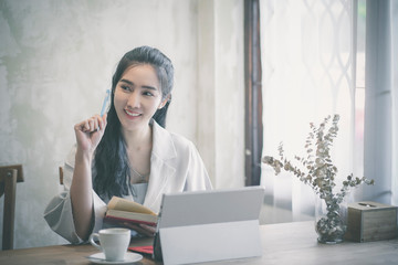 Confident happiness young woman working on laptop or notebook in her office.