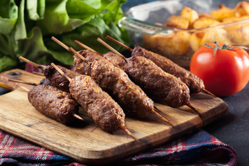 Grilled balkan cevapcici or  kebab on skewers