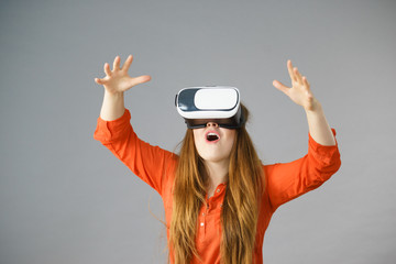 Girl wearing virtual reality goggles.