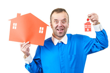 Man holding red house model and home keys