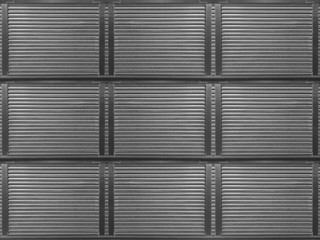 roller dark gray metal shutter door surface pattern wall design background.