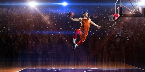 Basketball player in jump. around Arena with blue light spot