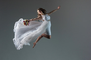 Girl in a wedding dress in flight