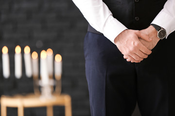 Pining man at funeral, closeup