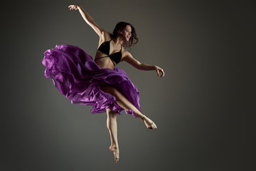 girl in a jump in a gray skirt