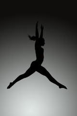 athletic jumping girl studio shot