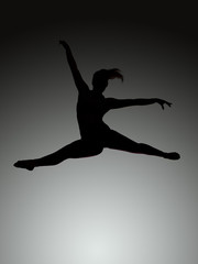Fototapeta na wymiar athletic jumping girl studio shot
