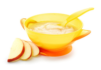Bowl with healthy baby food on white background