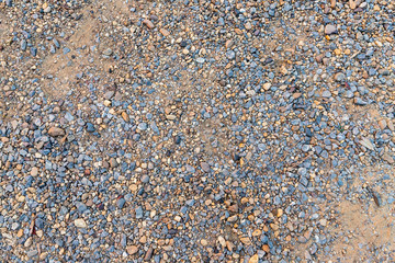 Colorful sand or pebble texture. Seamless texture on ground texture.