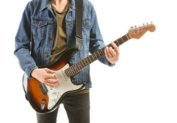 Fototapeta na wymiar Handsome young man playing guitar on white background