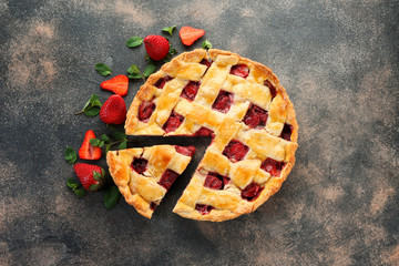 Tasty strawberry pie on dark background