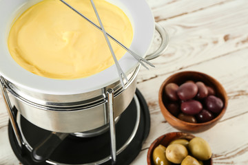 Cheese fondue on table