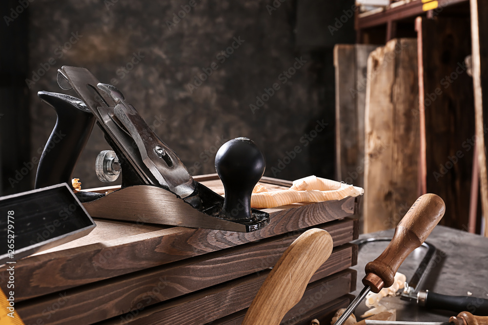 Wall mural Tools of carpenter on table in workshop