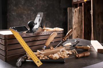 Tools of carpenter on table in workshop
