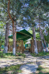 Fototapeta na wymiar Area for rest and eating. Gazebo in a picturesque place.