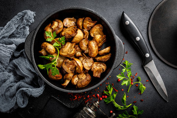 Fried mushrooms, champignons in pan