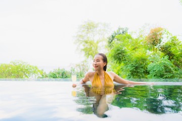 Portrait beautiful young asian woman with champagne glass for relax leisure