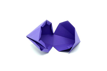 Geometric shape cut out of purple paper and photographed from above on white background. Geometry net of Octagonal Dipyramid. 2D shape that can be folded to form a 3D shape or a solid.