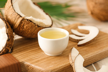 Bowl with coconut oil on table