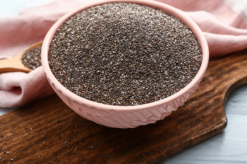 Bowl with chia seeds on table