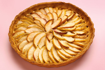 Tasty apple pie on color background