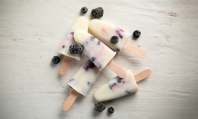 Tasty berry ice cream on white background