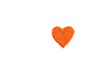 Red lentils in heart shape on white background. Healthy eating concept.